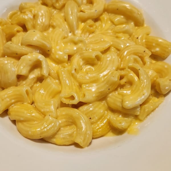 Close-up of Rib City's creamy macaroni and cheese, a classic BBQ side dish.